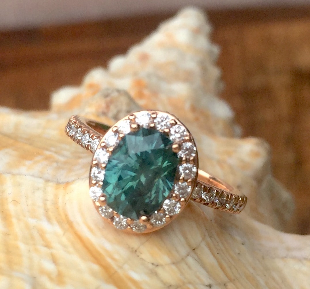 A photo from a customer review featuring a Montana sapphire set in a ring not made by Earth's Treasury