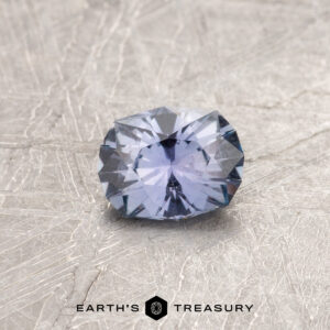 A blue Montana sapphire in a custom oval desing