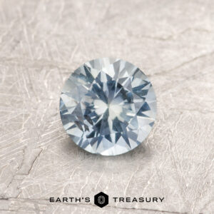 A blue Montana sapphire in a classic diamond round brilliant design