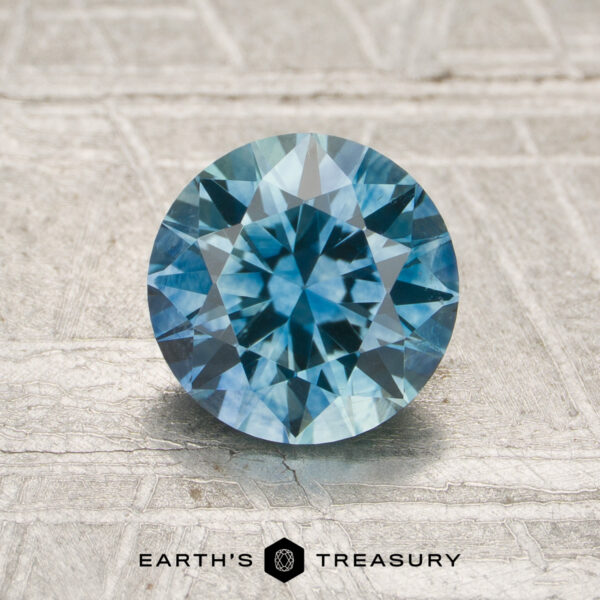 MS1820 A particolored Montana sapphire in a classic diamond round brilliant design