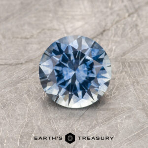 A blue Montana sapphire in a classic diamond round brilliant design