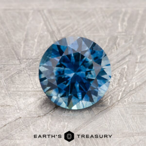 A blue Montana sapphire in a classic diamond round brilliant design