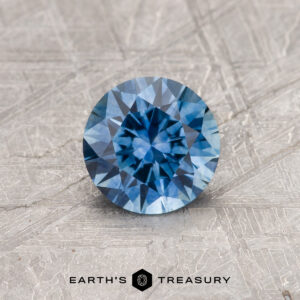 A blue Montana sapphire in a classic diamond round brilliant design