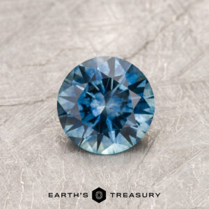 A blue Montana sapphire in a classic diamond round brilliant design