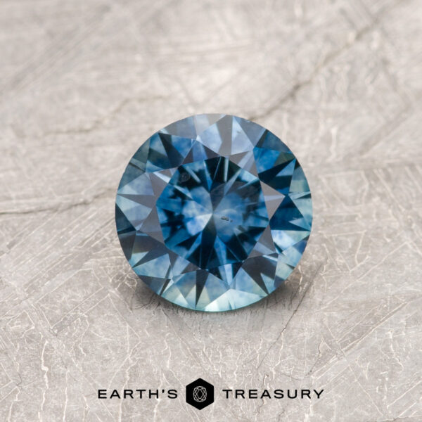 0.85-Carat Teal Blue Montana Sapphire (Heated) A blue Montana sapphire in a classic diamond round brilliant design