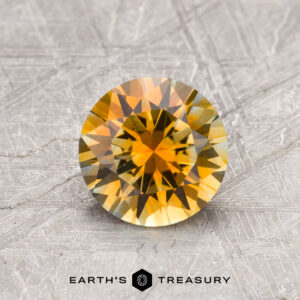 A yellow Montana sapphire in a classic diamond round brilliant design