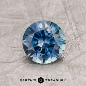 A blue Montana sapphire in a classic diamond round brilliant design