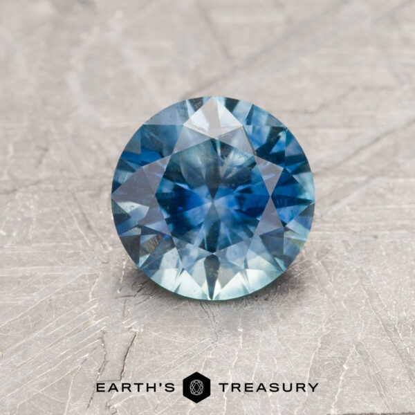 1.12-Carat Rich Aqua Blue Montana Sapphire (Heated) A blue-green Montana sapphire in a classic diamond round brilliant design