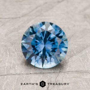A blue Montana sapphire in a classic diamond round brilliant design