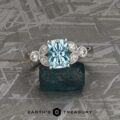 The "Calypso" ring in 14k white gold with 2.04-Carat Aquamarine, modified with larger diamonds and wider band