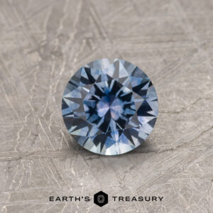 A purple Montana sapphire in a classic diamond round brilliant design