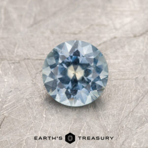 A blue Montana sapphire in a classic diamond round brilliant design