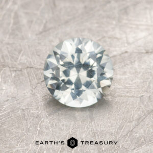 A white Montana sapphire in a classic diamond round brilliant design