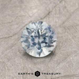 A blue Montana sapphire in a classic diamond round brilliant design
