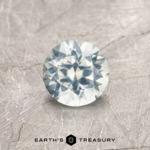 A white Montana sapphire in a classic diamond round brilliant design