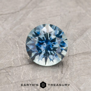 A blue Montana sapphire in a classic diamond round brilliant design