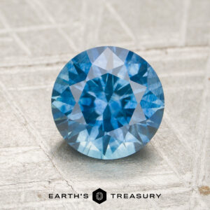A blue Montana sapphire in a classic diamond round brilliant design