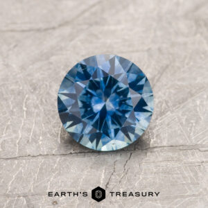 A blue Montana sapphire in a classic diamond round brilliant design