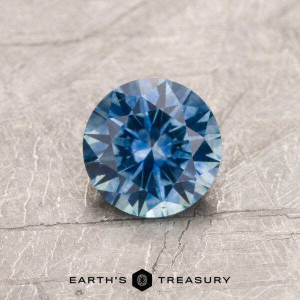 0.91-Carat Blue Montana Sapphire (Heated) A blue Montana sapphire in a classic diamond round brilliant design