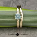 The "Snowflake" in 14k yellow gold, hammered, with 1.06-carat Montana sapphire; alongside the custom-fit contour band