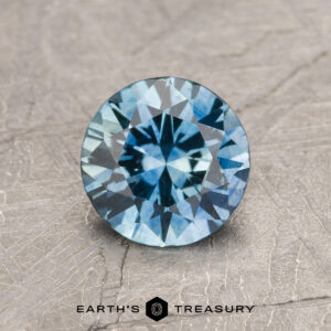 A blue Montana sapphire in a classic diamond round brilliant design