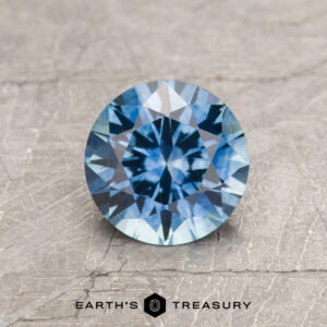 A blue Montana sapphire in a classic diamond round brilliant design