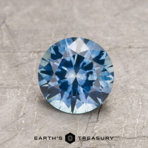 A blue Montana sapphire in a classic diamond round brilliant design
