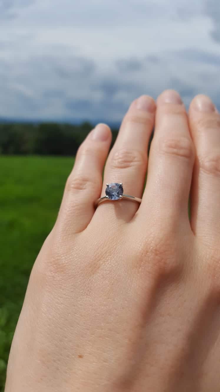 A photo from a customer review featuring a ring with a Montana sapphire
