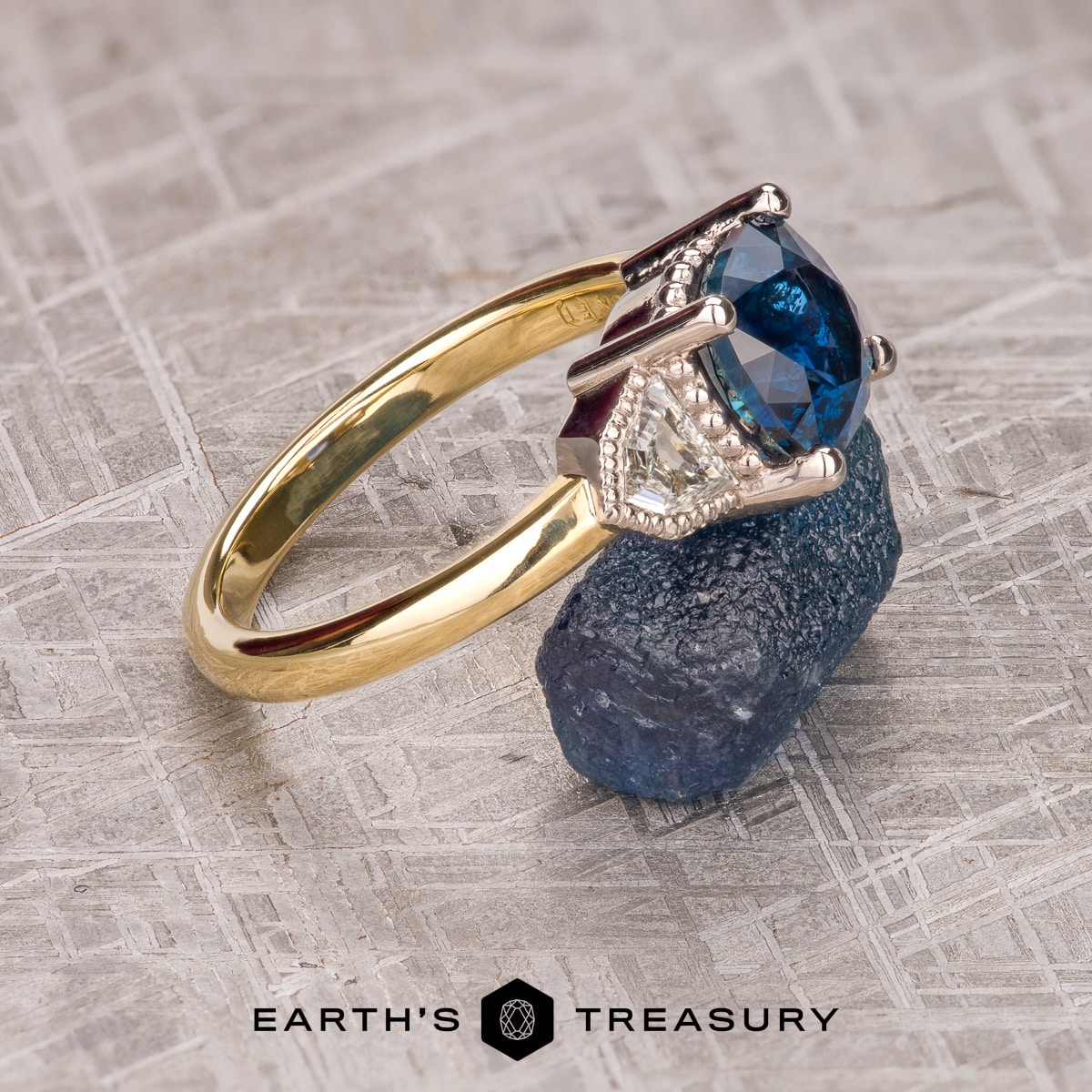 The "Celaeno" 3-Stone Ring in 18k yellow gold and platinum with 3.87-carat Montana sapphire