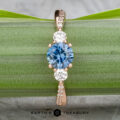 The "Lonicera" ring in 14k rose gold features a 0.93-carat Montana sapphire at its center, accented by two sparkling side stones—where nature’s elegance meets fine jewelry.