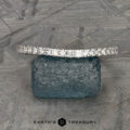 The petite pave diamond contour band in 14k white gold