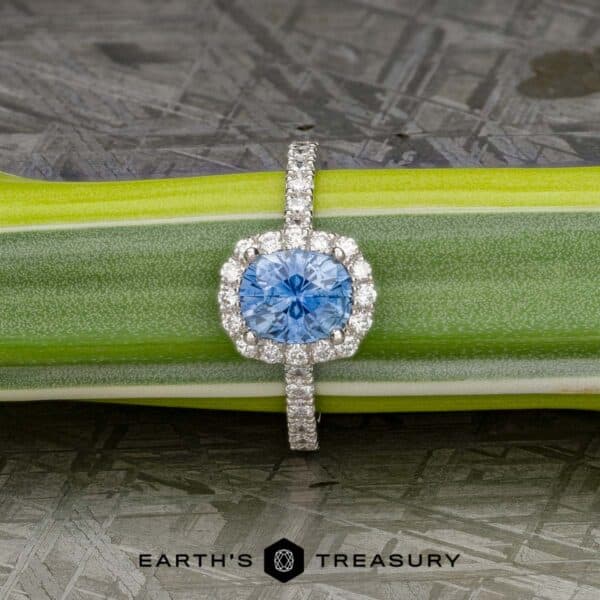 The classic pave halo ring in Platinum with 1.65-Carat Montana Sapphire