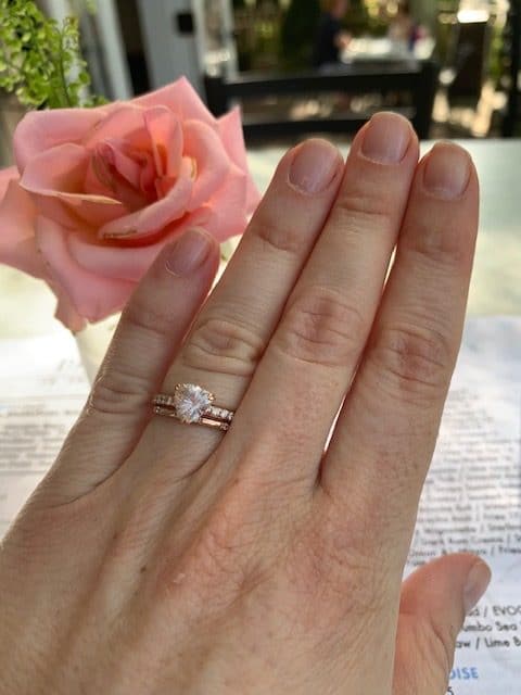 A photo from a customer review featuring a custom ring in 14k rose gold with 1.32-carat Montana sapphire