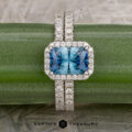 The Petite Pave Halo Ring in 14K white gold with 1.70-Carat Montana Sapphire, alongside the petite pave band in 14k white gold