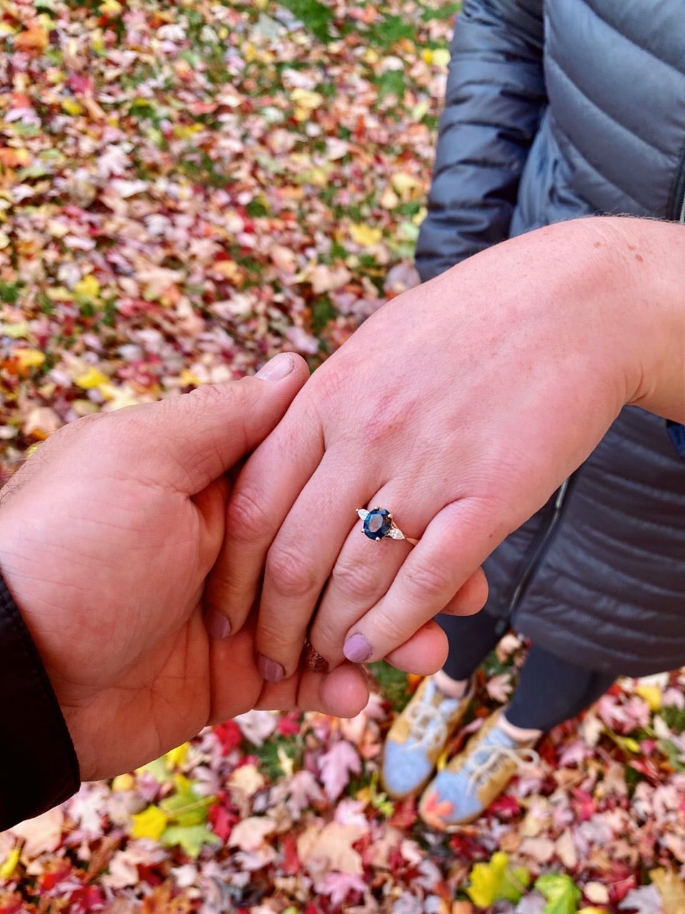 A photo from a customer review featuring a "Clematis" ring in 14k yellow gold with 2.39-carat Montana sapphire