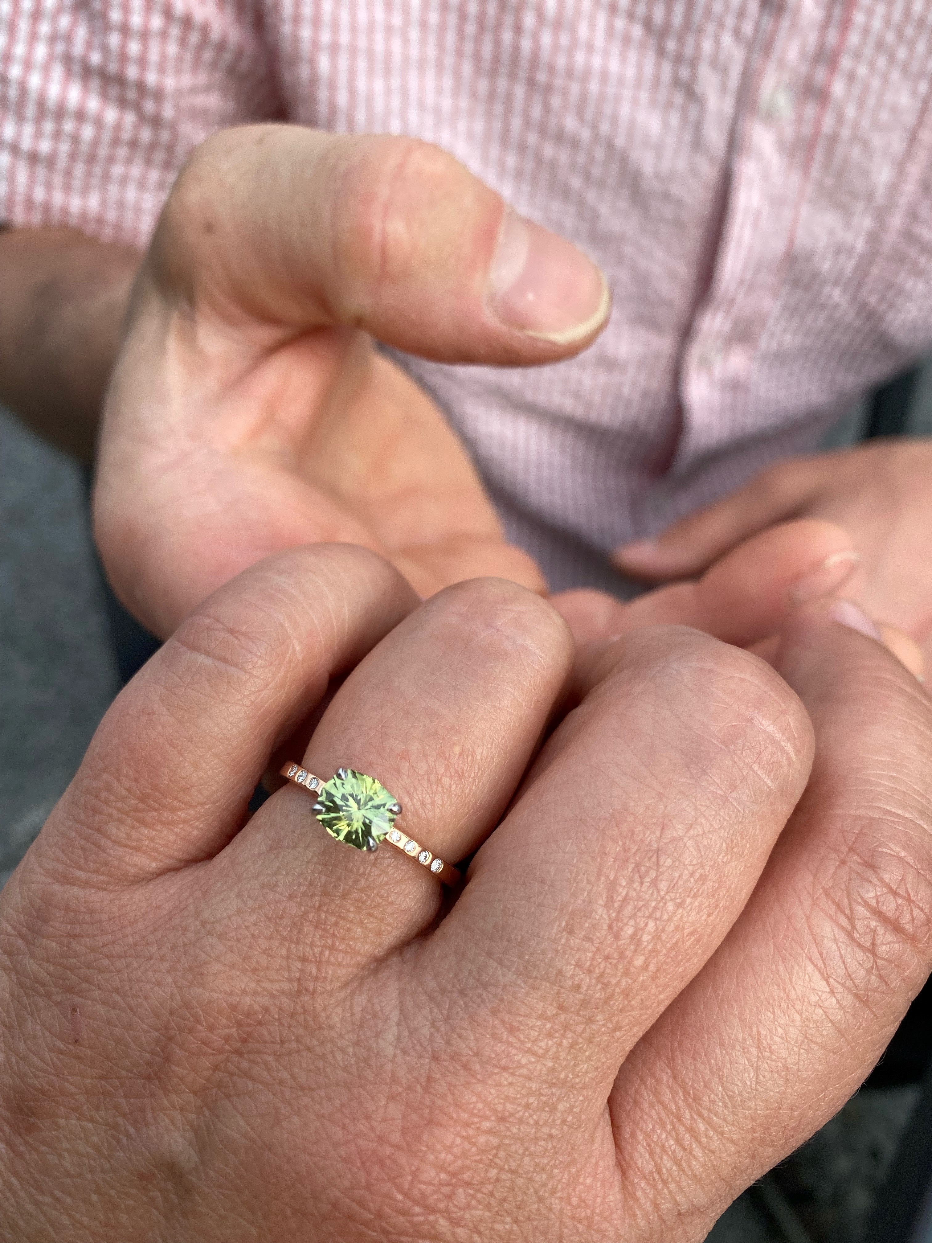 A photo from a customer review featuring a "Karelia" ring in 20k pink gold and platinum, with 1.43-Carat Montana Sapphire