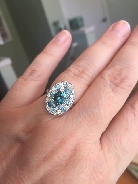 A photo from a customer review featuring a custom ring in 14k white gold with 1.45-Carat Montana Sapphire
