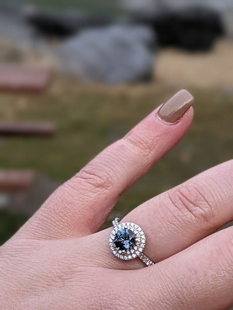 A photo from a customer review featuring a "Victoria" Ring in 14k rose and white gold with 1.05-Carat Montana Sapphire