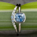 The "Deirdre" ring in platinum with 1.49-carat Montana sapphire, alongside the ombre "Rhine" band in platinum