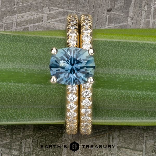 The "Amphitrite" ring in 14k yellow and white gold with 1.53-carat Montana sapphire, alongside the "Amphitrite" band in 14k yellow gold The "Amphitrite" ring in 14k yellow and white gold with 1.53-carat Montana sapphire, alongside the "Amphitrite" band in 14k yellow gold