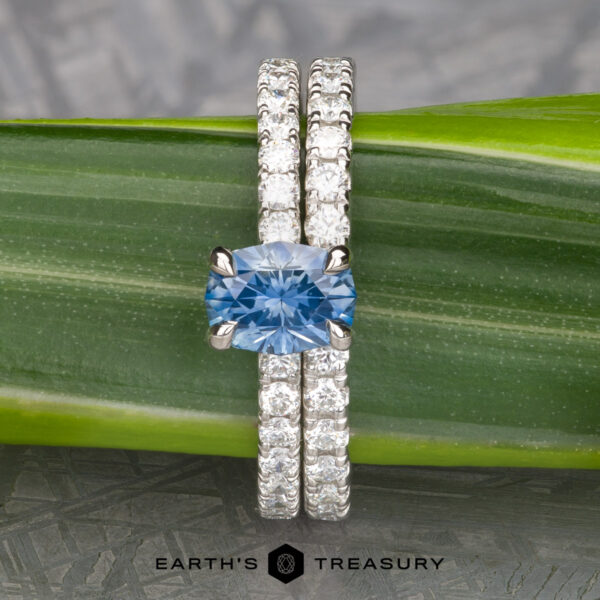 The Classic Pave "Bryony" Ring in Platinum with 1.03-Carat Montana Sapphire, alongside the Classic Pave Notched Diamond Band in platinum The Classic Pave "Bryony" Ring in Platinum with 1.03-Carat Montana Sapphire, alongside the Classic Pave Notched Diamond Band in platinum