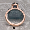 The ring "2022-01-10 11-13-01 (B,Radius1,Smoothing1)-1200-BW" stands before a rough blue stone, with "EARTH'S TREASURY" and a hexagon logo below, evoking the timeless allure of a solitaire game.