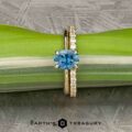 The "Flora" in 14k yellow gold with 1.34-carat Montana sapphire, alongside the "Odet" notched band in 14k yellow gold