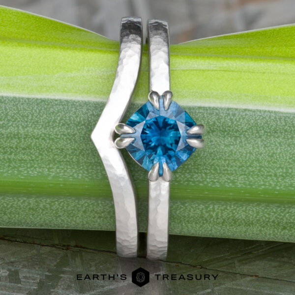 The “Capella” ring in 18k white gold, hammered and brushed, with 1.31-Carat Montana Sapphire, alongside the custom-fit contour band in 18k white gold, hammered and brushed The “Capella” ring in 18k white gold, hammered and brushed, with 1.31-Carat Montana Sapphire, alongside the custom-fit contour band in 18k white gold, hammered and brushed