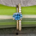 The "Flora" ring in 14k yellow gold with 1.34-carat Montana sapphire, alongside the "Odet" band in 14k yellow gold