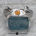 The Wide "Twyg" Sapphire Ring in 14k white gold with orange sapphire