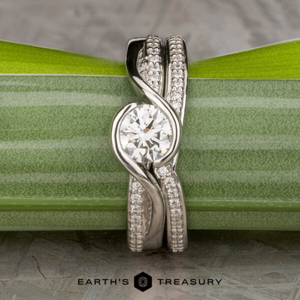 The "Faye" ring in platinum with 0.71-carat diamond, alongside the "Faye" band in platinum The "Faye" ring in platinum with 0.71-carat diamond, alongside the "Faye" band in platinum