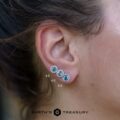 A size comparison between 4.0mm, 4.5mm, and 5.0mm size light aqua blue Montana sapphire halo earrings