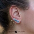 A size comparison between 4.0mm, 4.5mm, and 5.0mm size medium blue Montana sapphire halo earrings
