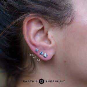 A size comparison between 3.5mm, 4.0mm, and 4.5mm size light aqua blue Montana sapphire earrings